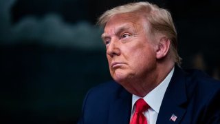 President Donald Trump listens during a White House videoconference with members of military on Nov. 26, 2020.