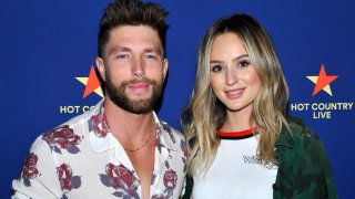 In this Feb. 19, 2019, file photo, Chris Lane and Lauren Bushnell pose for a photo backstage at Spotify's Hot Country Live Presents Florida Georgia Line at The Wiltern in Los Angeles, California.