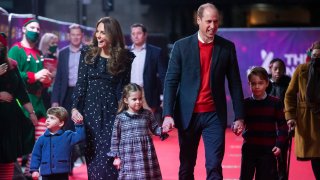 In this Dec. 11, 2020, file photo, Prince William, Duke of Cambridge, and Catherine, Duchess of Cambridge, with their children, Prince Louis, Princess Charlotte and Prince George, attend a special pantomime performance at London's Palladium Theatre, hosted by The National Lottery, to thank key workers and their families for their efforts throughout the pandemic in London, England.