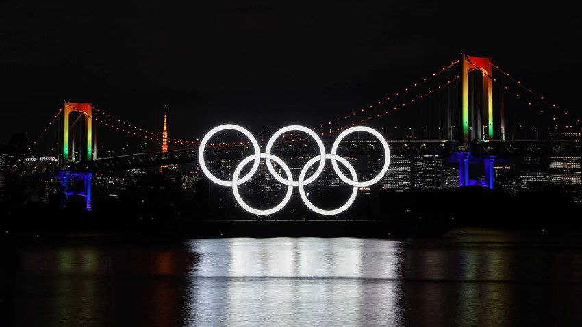 The illuminated Olympic rings, Rainbow Bridge and Tokyo Tower are seen at Tokyo Bay area, in Tokyo, Japan, Dec. 1, 2020.