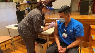 Trinity Health gives its first COVID vaccine