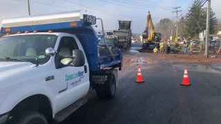 work crews dig up Route 74 in Vernon to repair a water main break