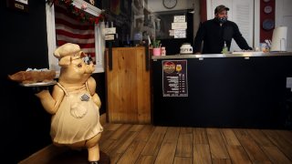 Manager Pat Ryan stands at the counter at the Pig Pit BBQ in Cohoes, NY on December 09, 2020. The pandemic crushed businesses on Boston’s Water Street.