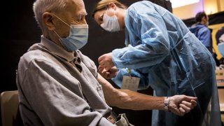 A man over 75 years receives a coronavirus (Covid-19) vaccine shot in Strasbourg, France.