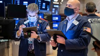 Traders work on the floor of the New York Stock Exchange.