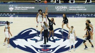 UConn tip-off against Butler to start an NCAA college basketball game Tuesday, Jan. 19, 2021, in Storrs, Connecticut.