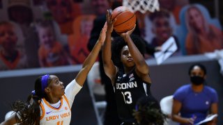 Connecticut's Christyn Williams (13) shoots with Tennessee's Jordan Walker (4) on defense during an NCAA college basketball game in Knoxville, Tennessee, Jan. 21, 2021.