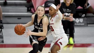 Connecticut guard Paige Bueckers (5) drives past Arkansas defender Makayla Daniels (43) during the second half of an NCAA college basketball game Thursday, Jan. 28, 2021, in Fayetteville, Ark.
