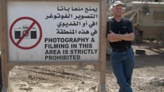 In this undated photo Mark Frerichs, a contractor from Illinois, poses in Iraq