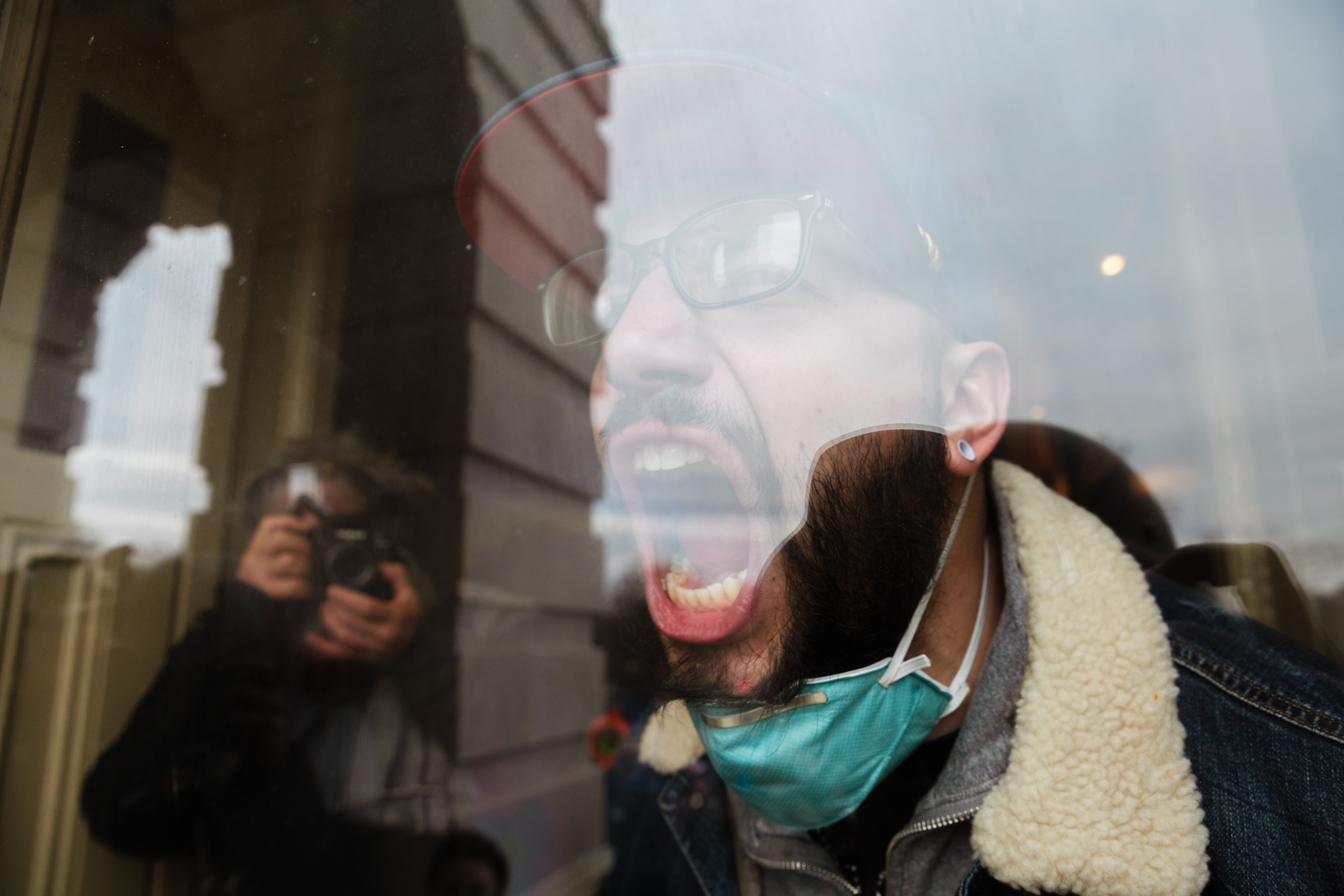 WASHINGTON, DC – JANUARY 06: A member of a pro-Trump mob screams out at the crowd from the inside of the Capitol Building after breaking into it on January 6, 2021 in Washington, DC. A pro-Trump mob stormed the Capitol, breaking windows and clashing with police officers. Trump supporters gathered in the nation’s capital today to protest the ratification of President-elect Joe Biden’s Electoral College victory over President Trump in the 2020 election. (Photo by Jon Cherry/Getty Images)