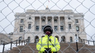A Minnesota State Troop stands guard on the steps of the Capitol building, in Saint Paul, United States, on January 16, 2021. Following the Capitol riot in Washington D.C. on January 6, state authorities around the country have stepped up security at government buildings as we head toward Inauguration Day. In St. Paul, over 100 law enforcement officers and National guard members were on guard Saturday in preparation for a Pro-Trump rally aimed at promoting widely disproved claims of election fraud.