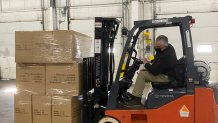 Hartford HealthCare's permanent stockpile warehouse in Newington holds face masks, shields, gowns, gloves, and IV solution.