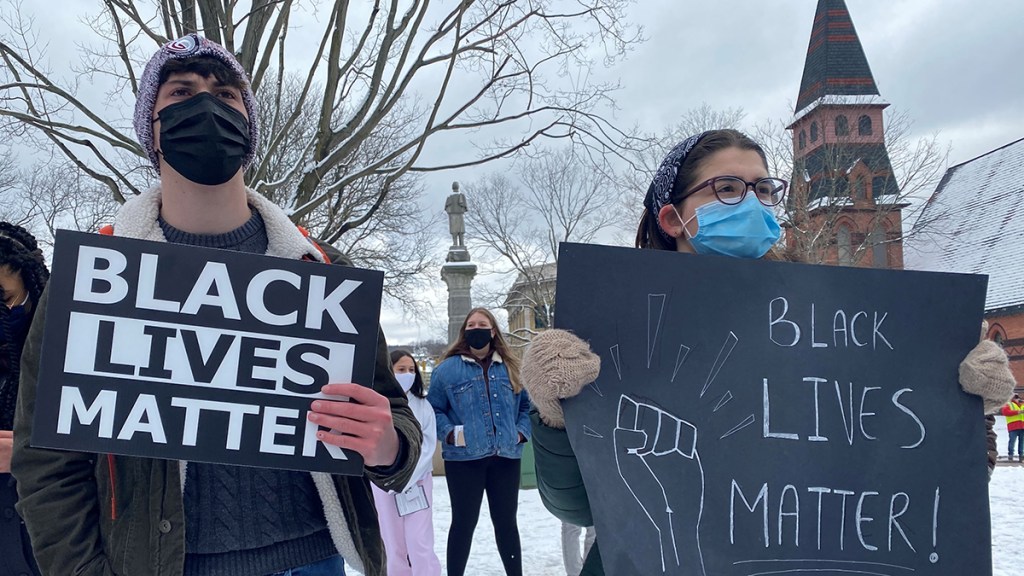 Students in Naugatuck hold Black Lives Matter signs