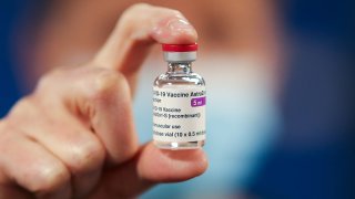 File: A healthcare worker holds a vial of AstraZeneca coronavirus disease vaccine at the Pentland Medical Practice on Jan. 7, 2021 in Currie, Scotland.