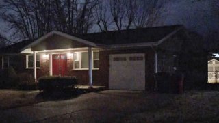 The house where neighbors say an 11-year-old girl found her parents dead from Covid-19 in St. Louis County, Mo.