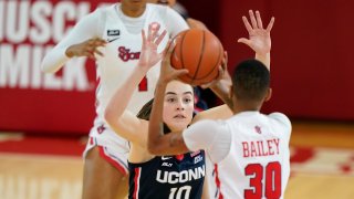 Connecticut guard Nika Muhl (10) defends St. John's guard Kadaja Bailey (30) as Bailey looks to pass during the first quarter of an NCAA college basketball game, Wednesday, Feb. 17, 2021, at St. John's University in the Queens borough of New York.