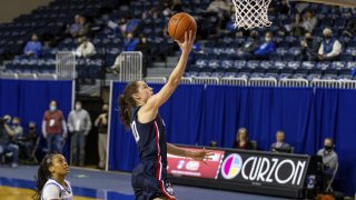 Connecticut guard Nika Muhl (10) makes a layup against Creighton guard DeArica Pryor (3) in the first quarter during an NCAA college basketball game Thursday, Feb. 25, 2021, in Omaha, Neb.