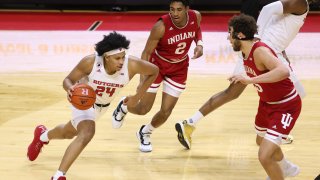 Ron Harper Jr. of Rutgers drives against Armaan Franklin and Race Thompson of Indiana during a game at Rutgers Athletic Center on Feb. 24, 2021, in Piscataway, New Jersey.
