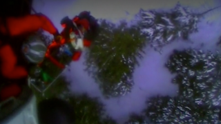 This screenshot from video shows the U.S. Coast Guard rescuing a skier who was attacked by a bear in Alaska's backcountry.
