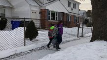 People with backpacks in the snow