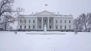 In this Jan. 31, 2021, file photo, snow falls on the North Lawn of the White House in Washington, D.C.