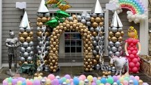 a castle built out of silver and gold balloons