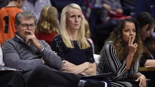 Connecticut head coach Geno Auriemma, left, watches play with assistant coaches Shea Ralph, center, and Jasmine Lister, right, during the second half of an NCAA exhibition women's college basketball game against Vanguard in Storrs, Conn., Sunday, Nov. 4, 2018.