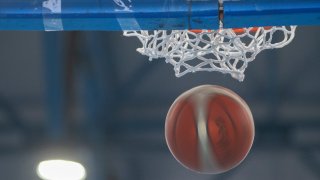File image of a basketball dropping in the air.