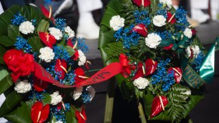 HONOLULU, HI - DECEMBER 07: The service wreath presentation as Pearl Harbor Commemorates the 78th Anniversary Of World War II Attacks at the Pearl Harbor National Memorial on December 7, 2019 in Honolulu, Hawaii. On the morning of December 7, 1941 the Japanese mounted a surprise military air strike on the naval base at Pearl Harbor leading to the United States' formal entry into World War II the next day. 2,335 were killed in the attack and dozens of naval ships were damaged or sunk.