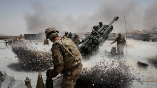 U.S. Army soldiers from the 2nd Platoon, B battery 2-8 field artillery, fire a howitzer artillery piece at Seprwan Ghar forward fire base in Panjwai district, Kandahar province southern Afghanistan, June 12, 2011.