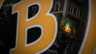 A Bitcoin sign is seen at the entrance of a cryptocurrency exchange office on April 16, 2021 in Istanbul, Turkey.