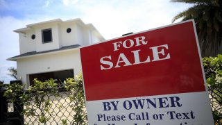 A “For Sale” sign outside a house in West Palm Beach, Florida, April 7, 2021.