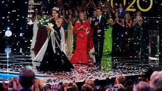 Camille Schrier, of Virginia, left, reacts after winning the Miss America competition