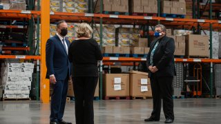 Doug Emhoff, husband of Vice President Kamala Harris, talks with Jodi Tyson, Vice President of Strategic Operations, and and Robert Thompson Deputy Administrator of the Supplemental Nutrition Assistance Program in Nevada, during a tour of Three Square Food Bank in Las Vegas, Nevada, March 15, 2021.