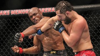 Kamaru Usman (L) of Nigeria fights Jorge Masvidal of the United States during the Welterweight Title bout of UFC 261 at VyStar Veterans Memorial Arena on April 25, 2021 in Jacksonville, Florida.