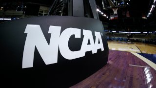INDIANAPOLIS, INDIANA - MARCH 21: The NCAA logo is seen on the basket stanchion before the game between the Oral Roberts Golden Eagles and the Florida Gators in the second round game of the 2021 NCAA Men's Basketball Tournament at Indiana Farmers Coliseum on March 21, 2021 in Indianapolis, Indiana.