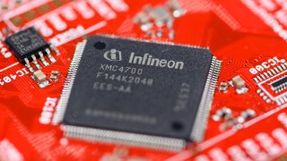 The Infineon logo can be seen on a chip on the board of a microcontroller kit at the Infineon Annual General Meeting in the Congress Center of the Munich Exhibition Center. Infineon is seen as one of Europe’s key technology firms in the semiconductor space.