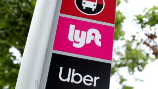 A sign marks a rendezvous location for Lyft and Uber users at San Diego State University in San Diego, California, May 13, 2020.