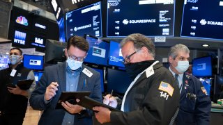 Traders working at the New York Stock Exchange (NYSE), on May 19, 2021.
