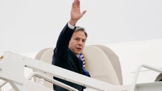 Secretary of State Antony Blinken waves as he departs Andrews Air Force Base, Maryland on May 24, 2021.