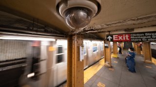 FILE - In this Oct. 7, 2020, file photo, a video surveillance camera is installed on the ceiling above a subway platform in the Court Street station in the Brooklyn borough of New York. State lawmakers across the U.S. are reconsidering the tradeoffs of facial recognition technology amid civil rights and racial bias concerns.