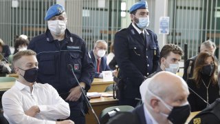 Finnegan Lee Elder, left, and co-defendant Gabriel Natale-Hjorth, right, sit before a jury began deliberating their fate in the trial for the slaying of an Italian plainclothes police officer on a street near the hotel where they were staying while on vacation in Rome in summer 2019, in Rome, Wednesday, May 5, 2021.