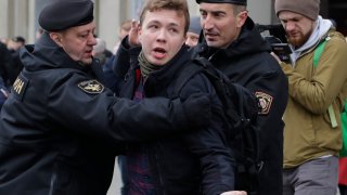 In this Sunday, March 26, 2017, file photo, Belarus police detain journalist Raman Pratasevich, center, in Minsk, Belarus. Raman Pratasevich, a founder of a messaging app channel that has been a key information conduit for opponents of Belarus’ authoritarian president, has been arrested after an airliner in which he was riding was diverted to Belarus because of a bomb threat. The presidential press service said President Alexander Lukashenko personally ordered that a MiG-29 fighter jet accompany the Ryanair plane — traveling from Athens, Greece, to Vilnius, Lithuania — to the Minsk airport.
