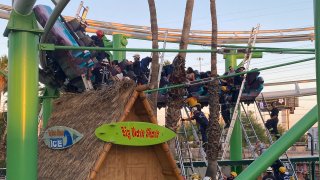 This photo provided by Glendale Fire Department responders rescuing people stuck on a roller coaster at Castles N’ Coasters on Saturday, May 15, 2021 in Phoenix. The Phoenix Fire Department said the ride got stuck Saturday, with riders perched 20 feet (six meters) off the ground. Rescue crews were dispatched and were able to escort 22 people off the ride safely.