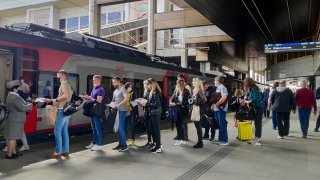 Passengers at a railway station in Minsk, Belarus, stand in line to board a high-speed train to Moscow on Friday, May 28, 2021. Many people who want to leave Belarus to avoid the growing repression under authoritarian President Alexander Lukashenko now find themselves increasingly cornered. The country tightened restrictions at its land borders in December, and now the European Union has moved to ban all flights from Belarus after the diversion of a Ryanair jet to Minsk, where authorities arrested a dissident journalist who was aboard.