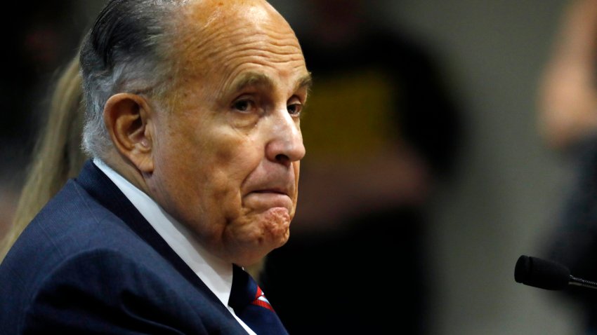 Rudy Giuliani, personal lawyer of US President Donald Trump, looks on during an appearance before the Michigan House Oversight Committee in Lansing, Michigan on December 2, 2020. – The president’s attorneys, led by Rudy Giuliani, have made numerous allegations of election fraud. (Photo by JEFF KOWALSKY / AFP) (Photo by JEFF KOWALSKY/AFP via Getty Images)