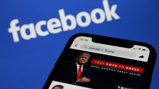 Donald Trump's Facebook account is seen displayed on a phone screen with Facebook logo in the background in this illustration photo taken in Krakow, Poland on May 6, 2021