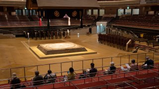 Local residents sit near the dohyo (sumo ring) as they wait under observation after receiving a coronavirus vaccine at Ryogoku Kokugikan sumo arena on May 24, 2021 in Tokyo, Japan. With one of the lowest Covid-19 vaccination rates in the developed world and with the Tokyo Olympic Games little over two months away, Japanese authorities have ramped up their inoculation efforts with mass vaccination sites opening today in Tokyo and Osaka as well as more community vaccination centres around the country.