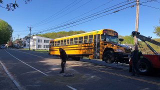 School bus being towed after a crash in Seymour