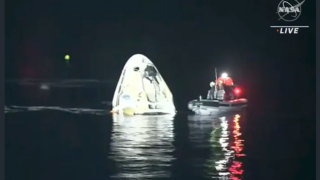 In this image made from NASA TV video, the SpaceX Dragon capsule floats after landing in the Gulf of Mexico near the Florida Panhandle early Sunday, May 2, 2021. SpaceX returned four astronauts from the International Space Station on Sunday, making the first U.S. crew splashdown in darkness since the Apollo 8 moonshot.